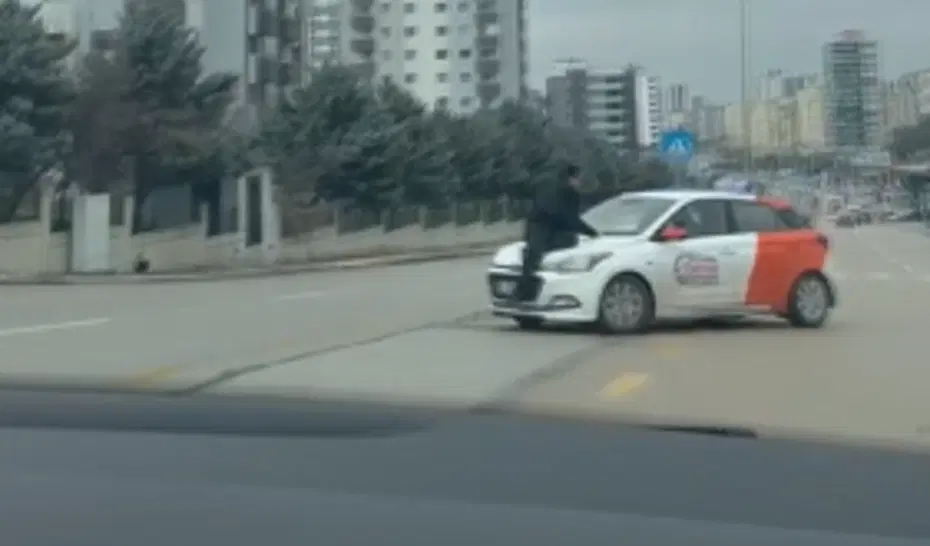 Tartışma sonrası aracın kaputunda metrelerce sürüklendi